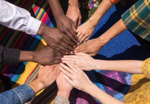 Photo of a diverse group of people's hands